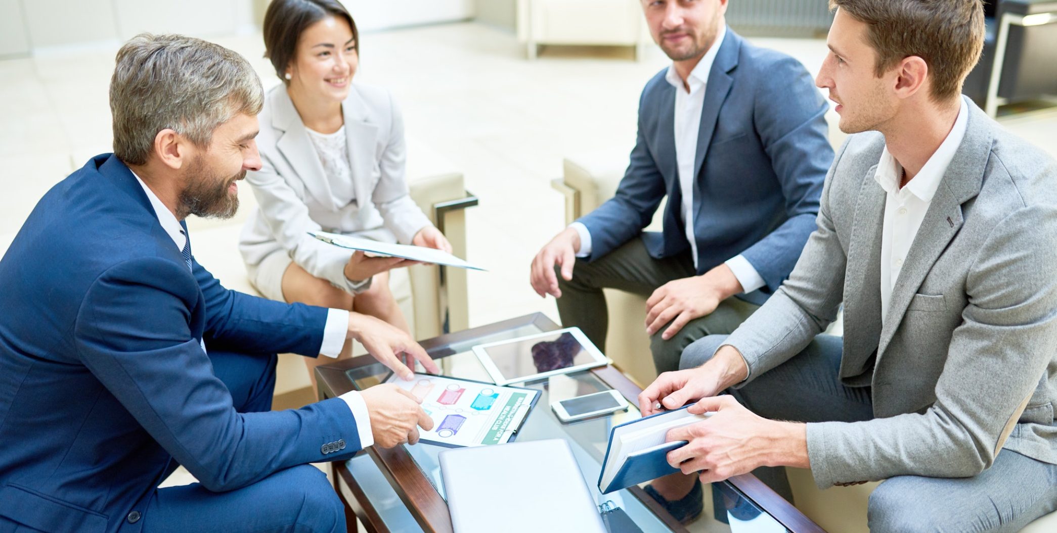 team-of-cheerful-business-people-in-meeting.jpg